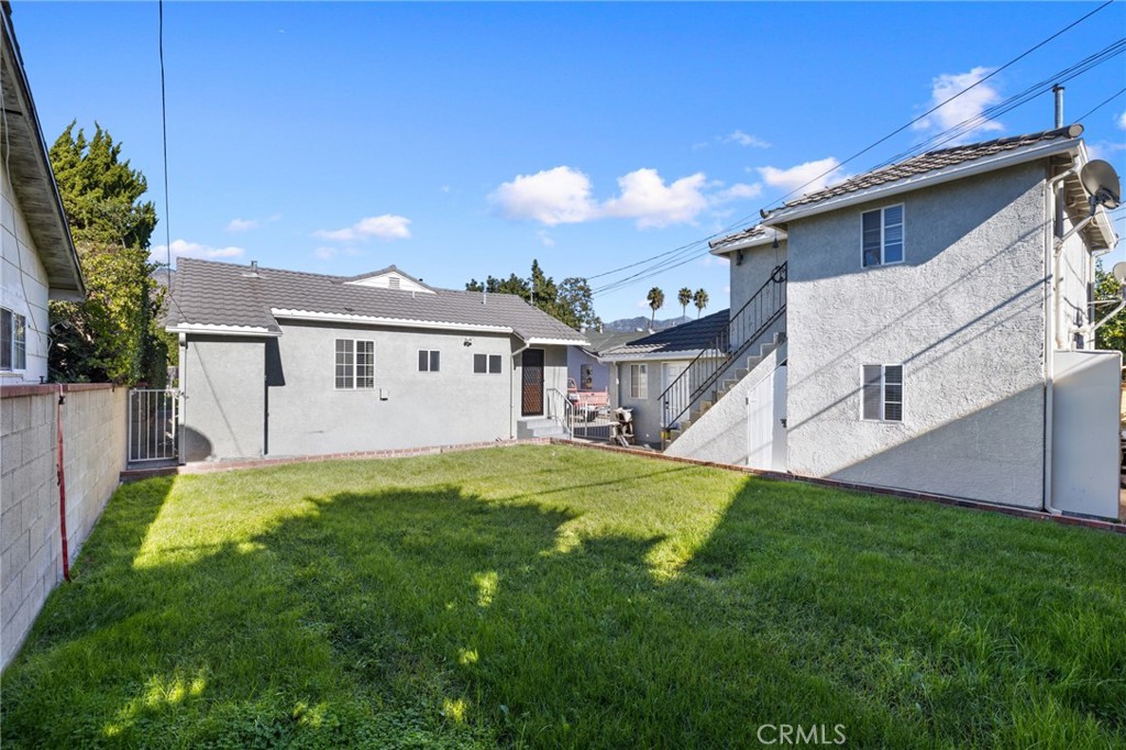 3920 Elma Road Pasadena, CA 91107 - Photo 28 of 29 a view of a house with a yard and deck