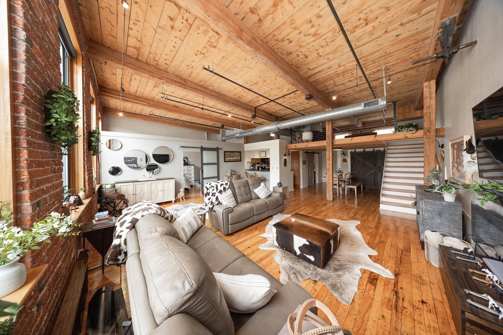 a view of a patio with table and chairs with wooden floor