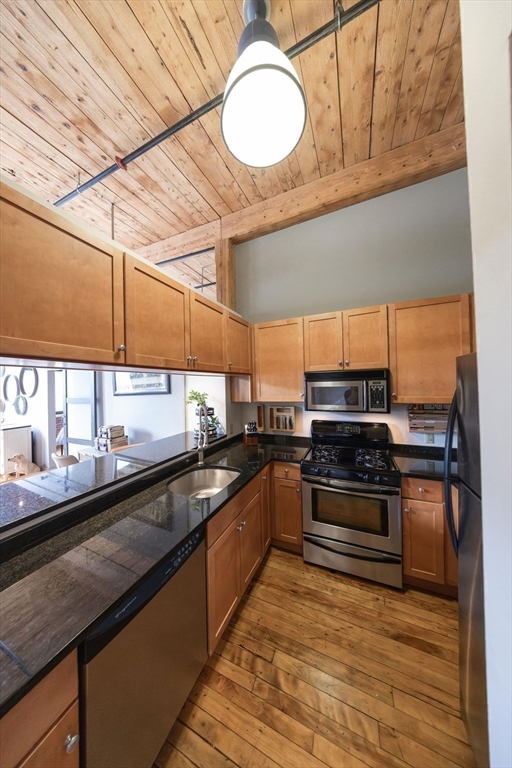 1 Envelope Terrace, Unit 302 Worcester, MA 01604 - Photo 17 of 42 a kitchen with stainless steel appliances a stove sink and cabinets