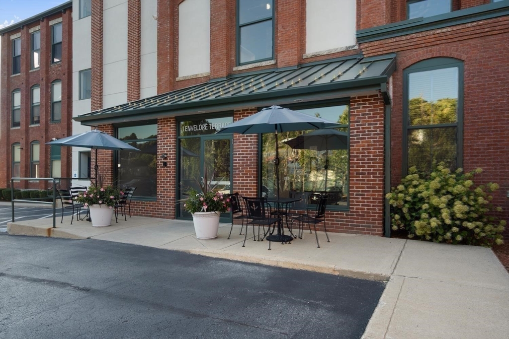 1 Envelope Terrace, Unit 302 Worcester, MA 01604 - Photo 34 of 42 a view of a building with sitting area