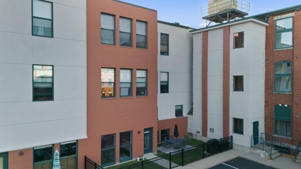 1 Envelope Terrace, Unit 302 Worcester, MA 01604 - Photo 39 of 42 a front view of a building with a yard