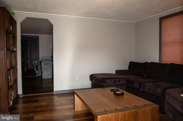 a kitchen with stainless steel appliances granite countertop a stove a sink dishwasher a refrigerator and a microwave