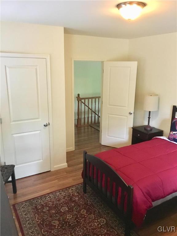 82 Waldheim Park Allentown, PA 18103 - Photo 15 of 22 a bedroom with a bed and wooden floor