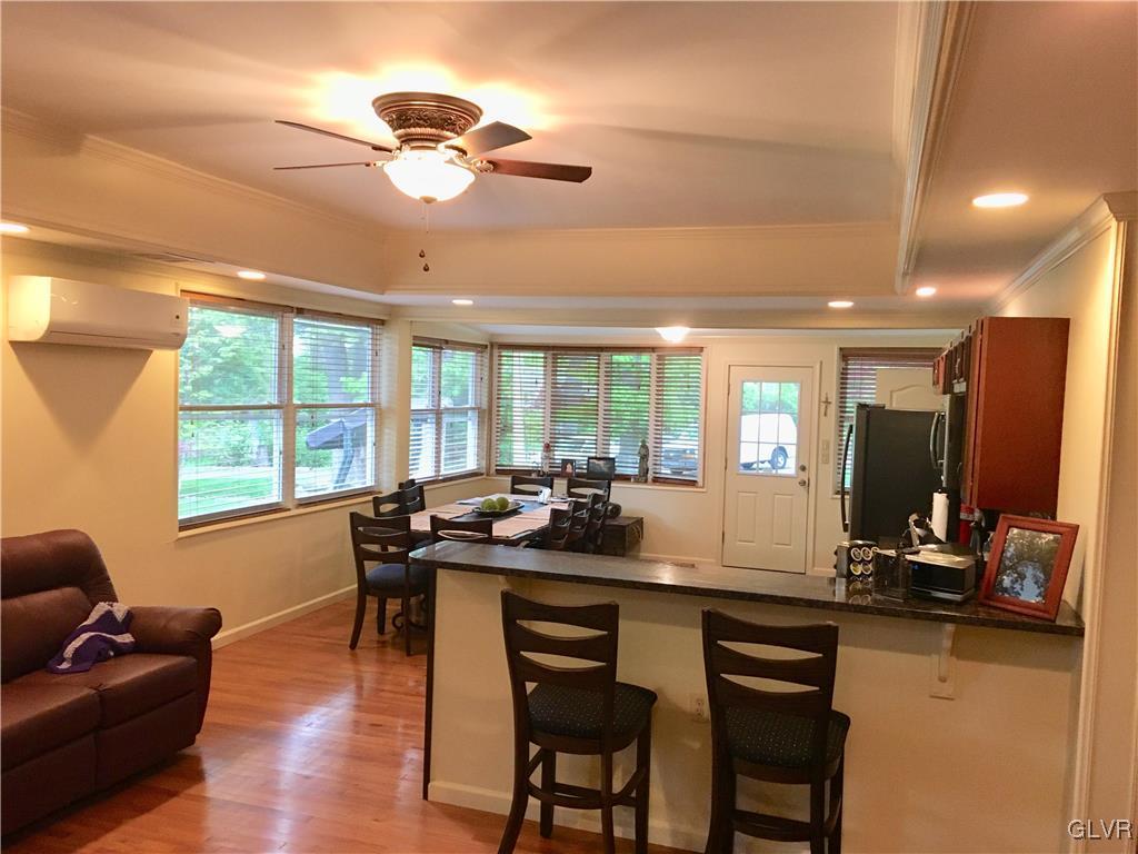 82 Waldheim Park Allentown, PA 18103 - Photo 5 of 22 a kitchen with a table chairs stove and wooden floor