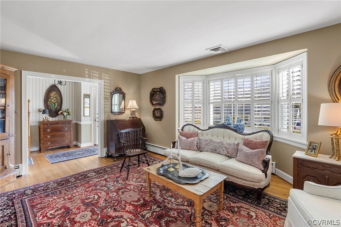 214 Ralston Road Henrico, VA 23229 - Photo 8 of 41 a living room with furniture and a floor to ceiling window