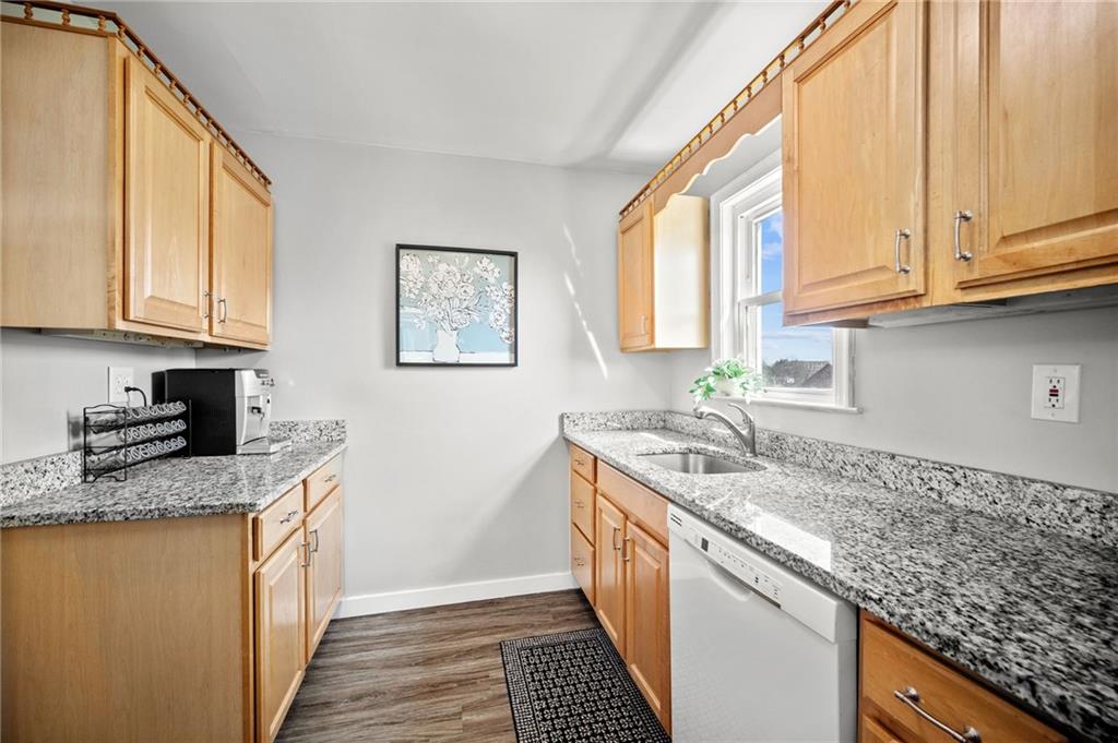 416 Phillips Avenue McKees Rocks, PA 15136 - Photo 18 of 46 a kitchen with stainless steel appliances granite countertop a sink stove and cabinets