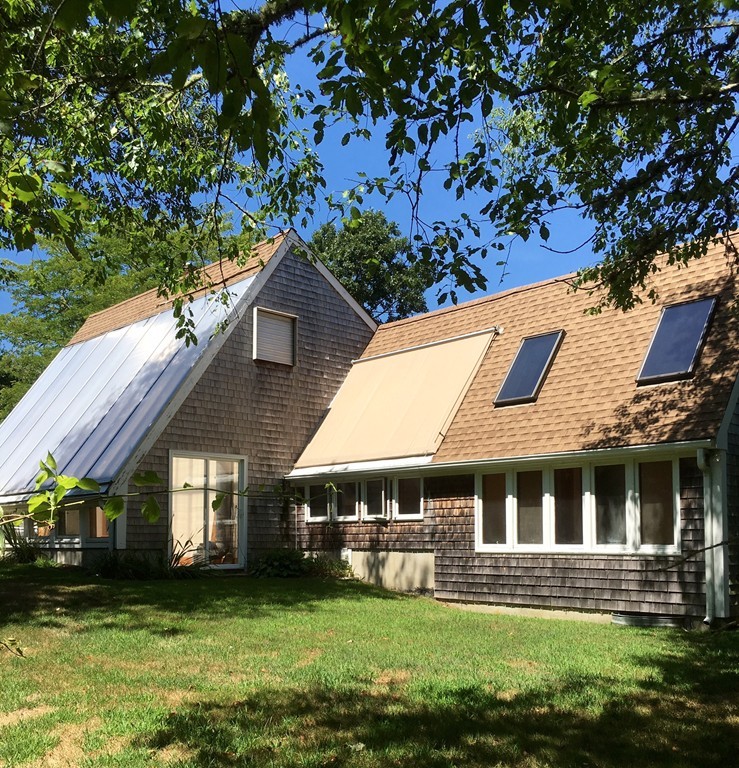 1470 Main Road Westport, MA 02790 - Photo 2 of 17 a front view of a house with a garden