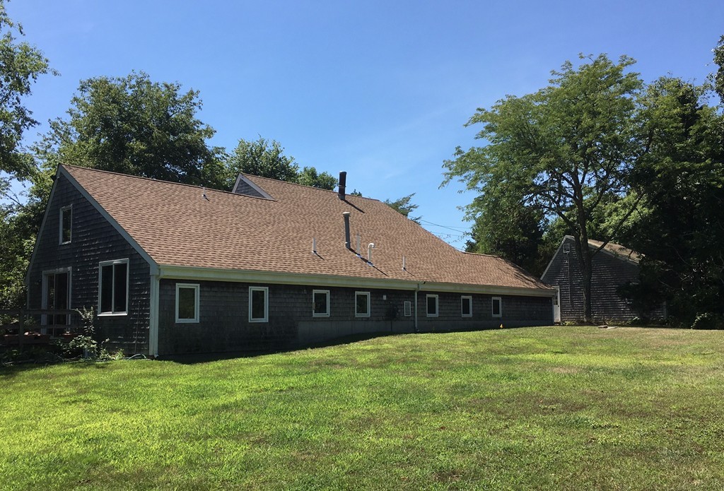1470 Main Road Westport, MA 02790 - Photo 4 of 17 a front view of a house with a garden