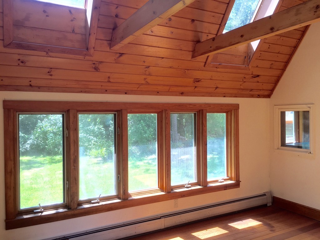 1470 Main Road Westport, MA 02790 - Photo 6 of 17 a view of a room has large windows and wooden roof