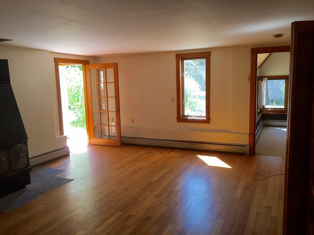 1470 Main Road Westport, MA 02790 - Photo 8 of 17 an empty room with wooden floor and windows
