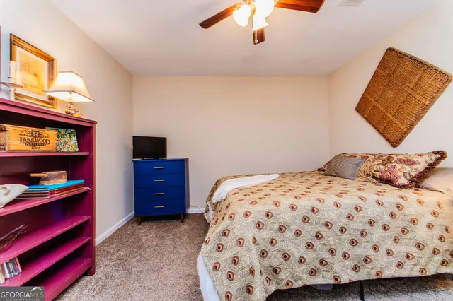 a bedroom with a bed and a dresser