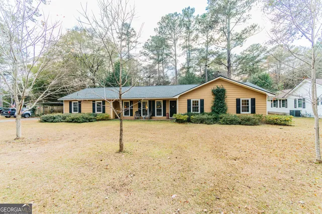a house with a tree in the background