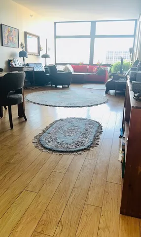 a view of living room with furniture and wooden floor
