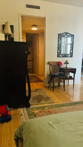 a room with furniture pool table and window