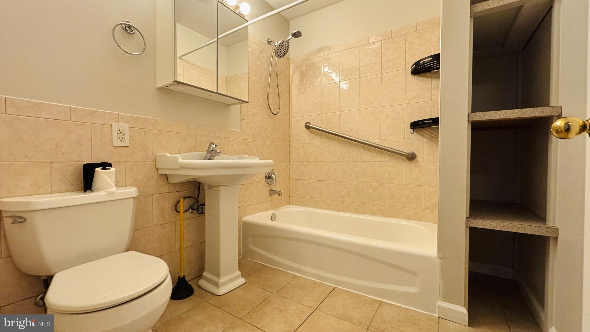 1925 South Bancroft Street Philadelphia, PA 19145 - Photo 11 of 12 a bathroom with a toilet and a shower