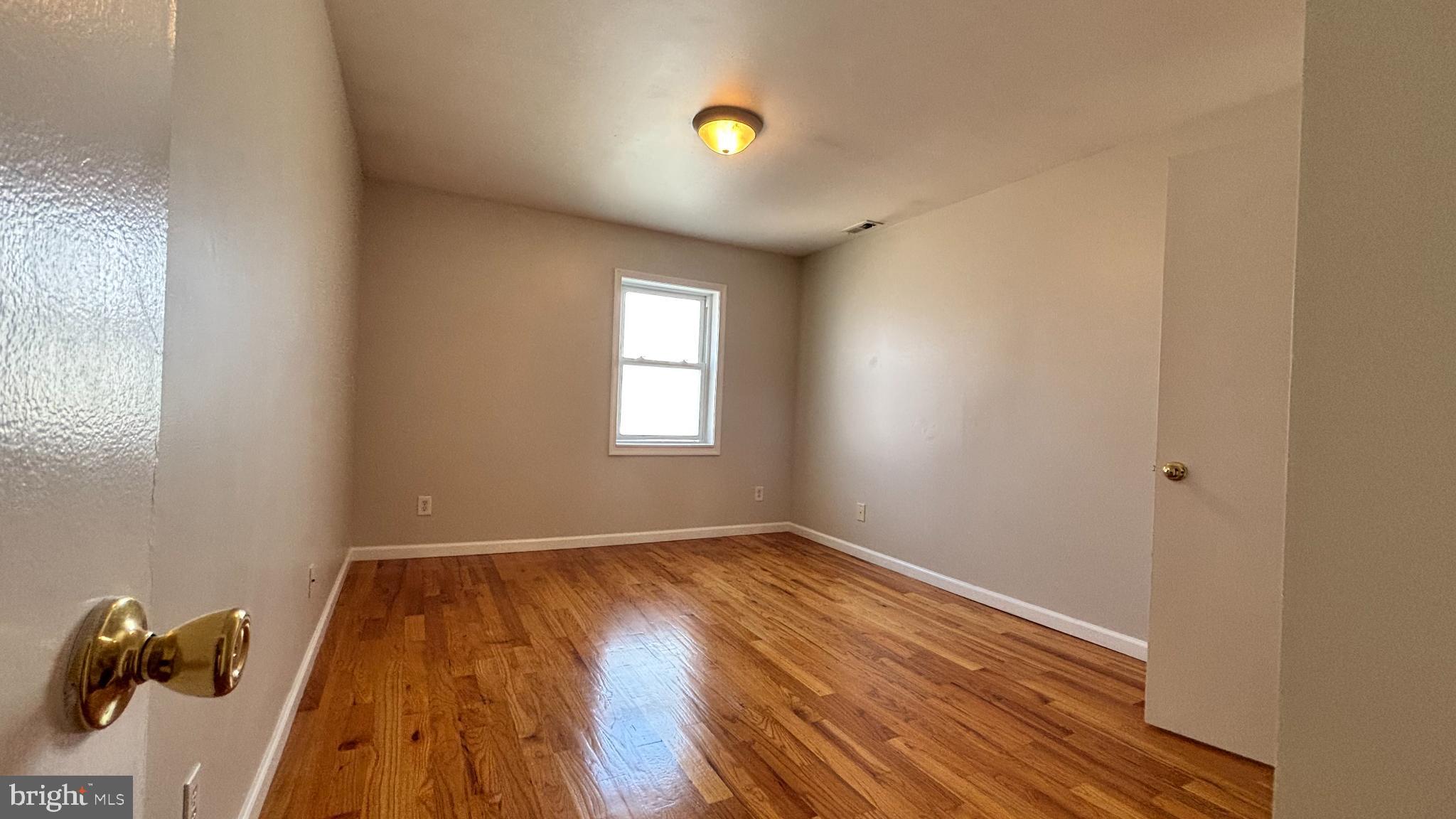 1925 South Bancroft Street Philadelphia, PA 19145 - Photo 12 of 12 an empty room with windows