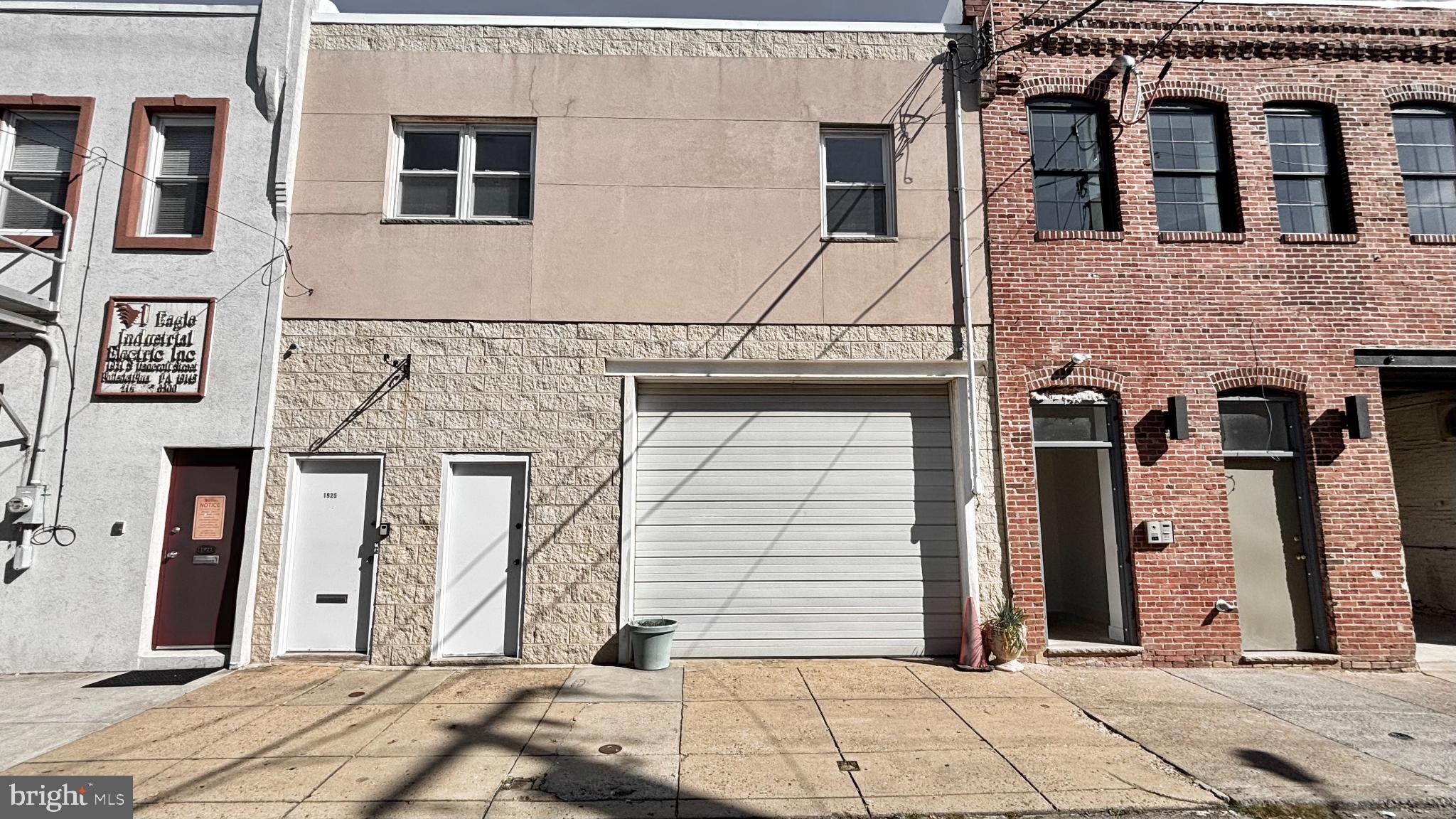 1925 South Bancroft Street Philadelphia, PA 19145 - Photo 2 of 12 a view of a brick house with large windows