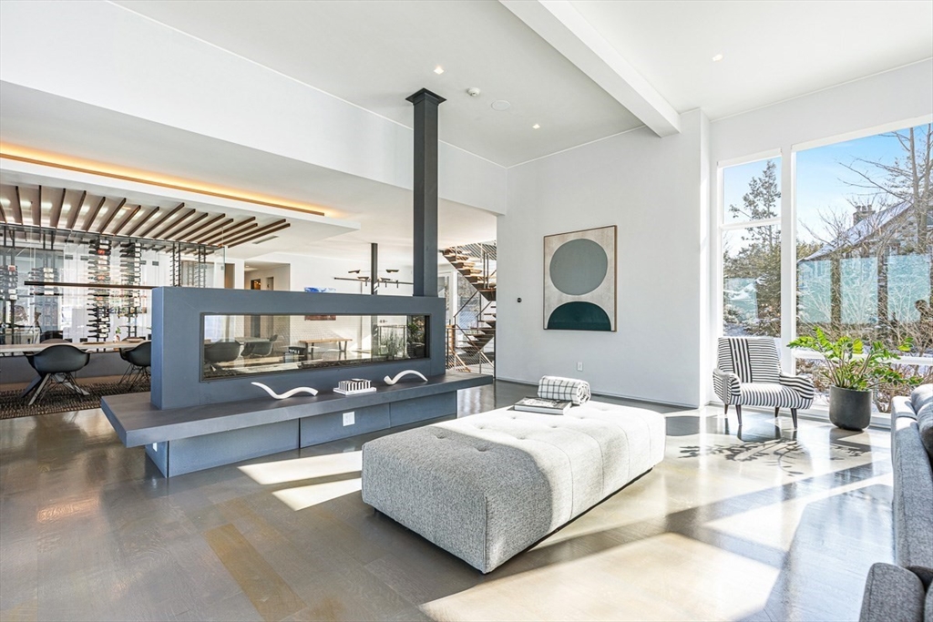 85 Forbes Road Milton, MA 02186 - Photo 11 of 39 a bedroom with a large bed and a large window