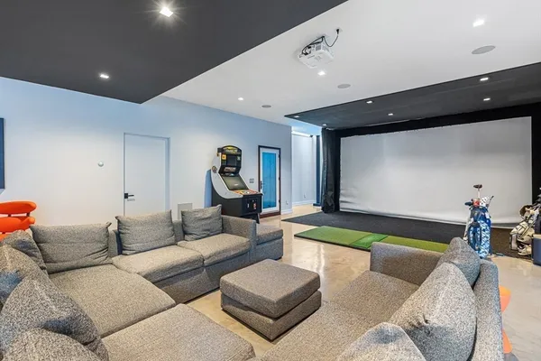 a bedroom with a bed a couch and a window