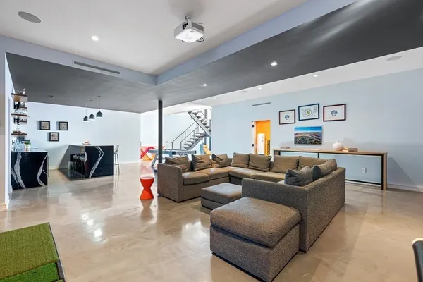 a spacious bedroom with a large bed and a large window