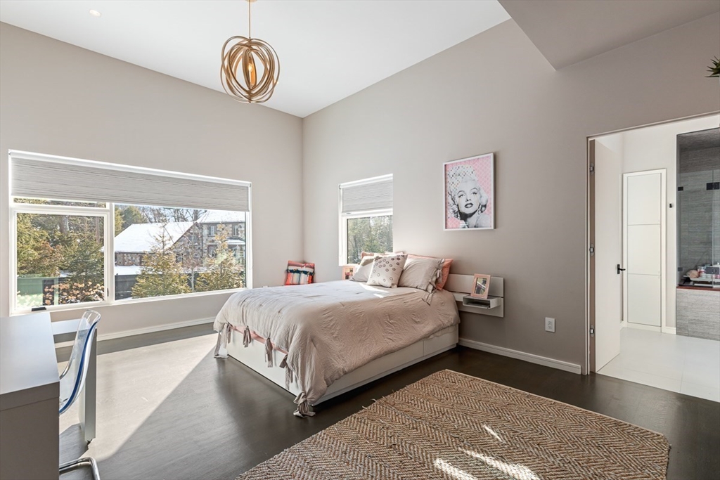 85 Forbes Road Milton, MA 02186 - Photo 28 of 39 a bed room with a bed and a window