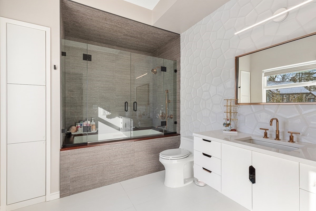 85 Forbes Road Milton, MA 02186 - Photo 29 of 39 a bathroom with a sink a toilet and shower