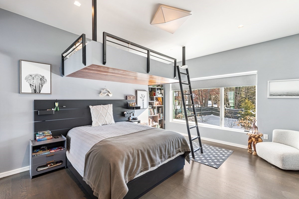 85 Forbes Road Milton, MA 02186 - Photo 30 of 39 a bedroom with a bed a couch and a window