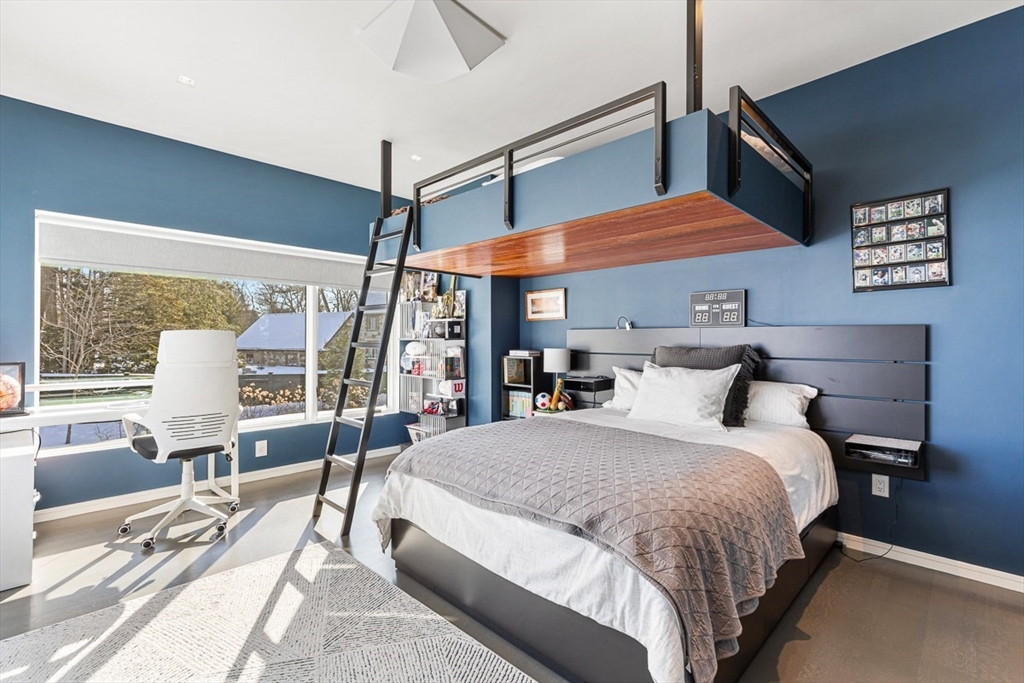 85 Forbes Road Milton, MA 02186 - Photo 31 of 39 a bed room with a bed and chair