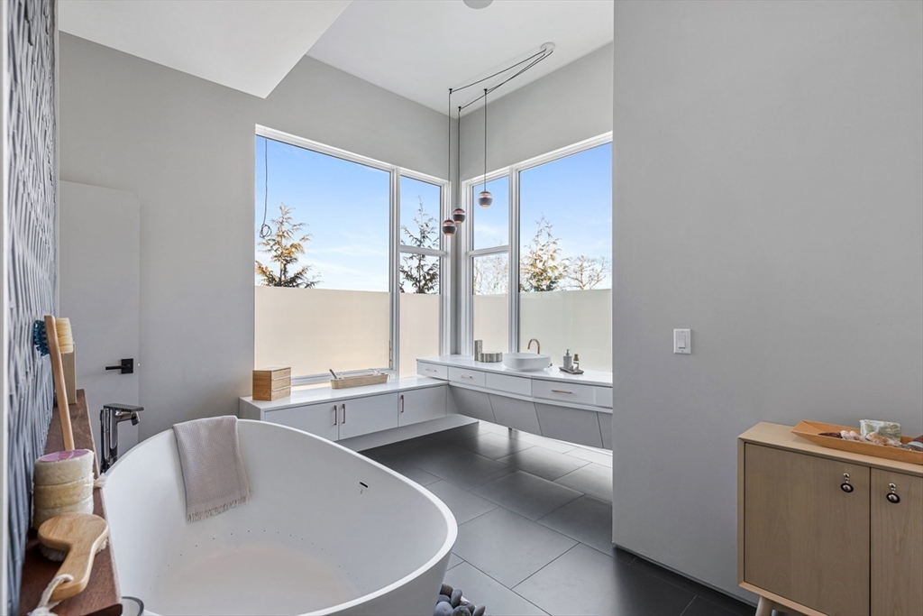 85 Forbes Road Milton, MA 02186 - Photo 37 of 39 a dining room with a window and couch