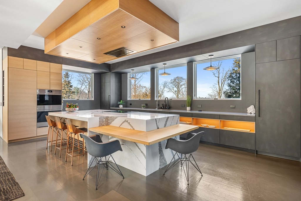 85 Forbes Road Milton, MA 02186 - Photo 7 of 39 a patio with swimming pool and outdoor seating