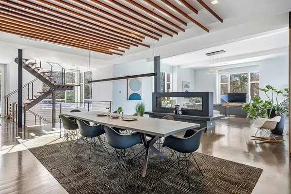 a bedroom with a large bed and a large window