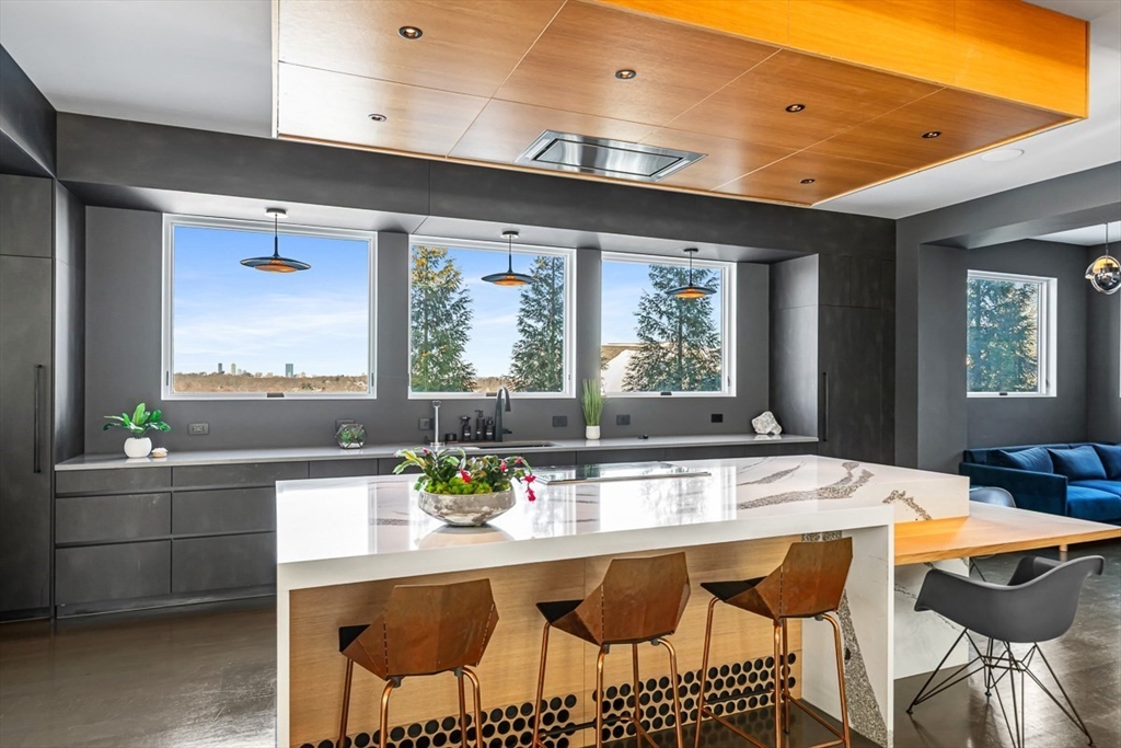 85 Forbes Road Milton, MA 02186 - Photo 9 of 39 a dining table with chairs and window