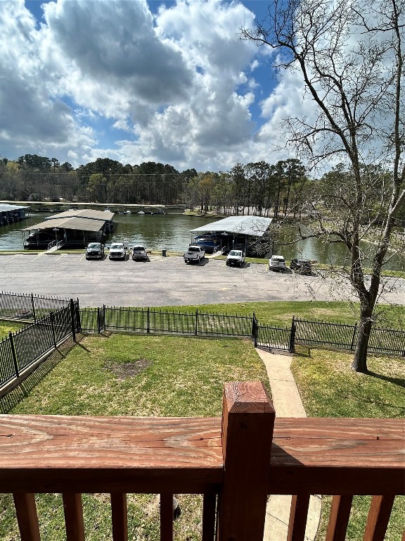 30 Harbour Lane Coldspring, TX 77331 - Photo 17 of 31 a view of a lake with a yard