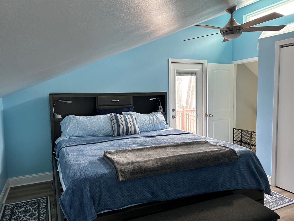 30 Harbour Lane Coldspring, TX 77331 - Photo 24 of 31 a bed sitting in a bedroom next to a window