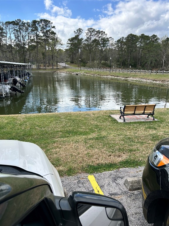 30 Harbour Lane Coldspring, TX 77331 - Photo 31 of 31 a view of a lake with a yard