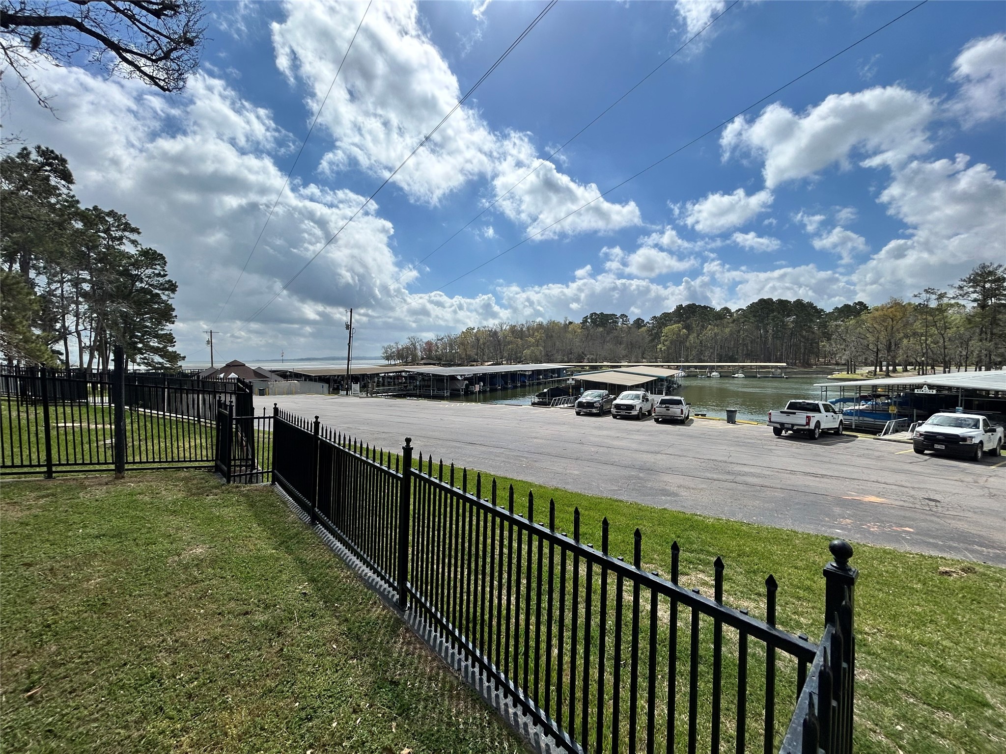 30 Harbour Lane Coldspring, TX 77331 - Photo 6 of 31 a view of a pathway with a wrought fence