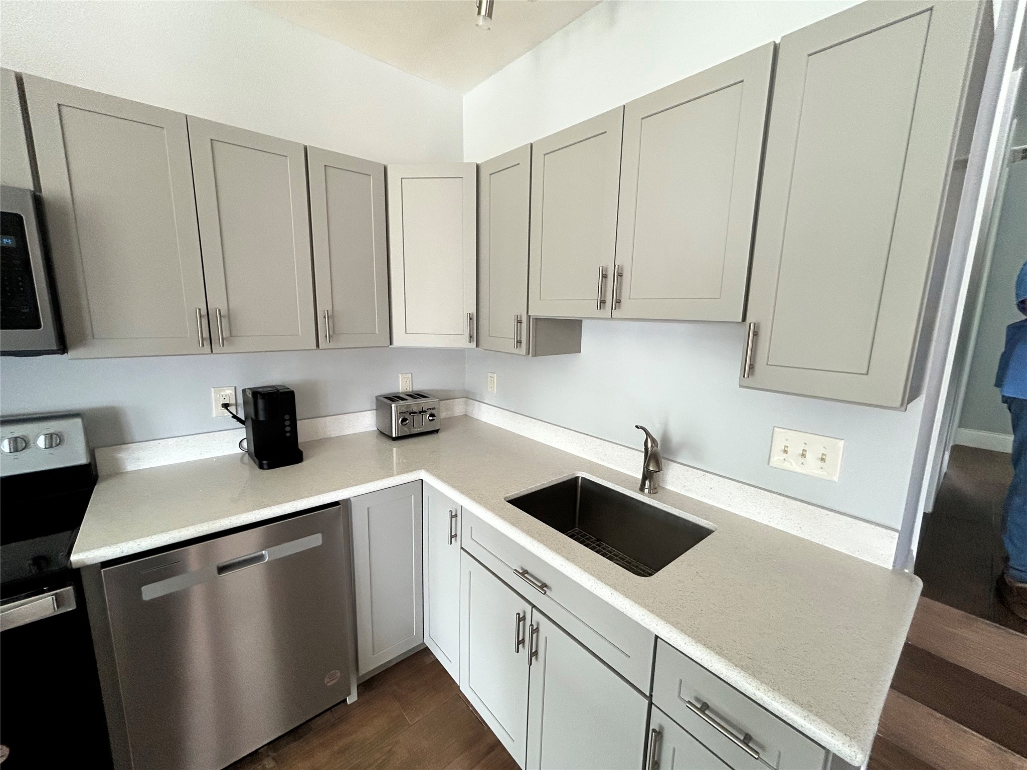 30 Harbour Lane Coldspring, TX 77331 - Photo 9 of 31 a kitchen with white cabinets sink and white appliances