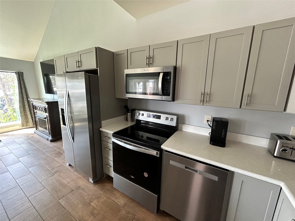 30 Harbour Lane Coldspring, TX 77331 - Photo 10 of 31 a kitchen with a refrigerator stove and microwave