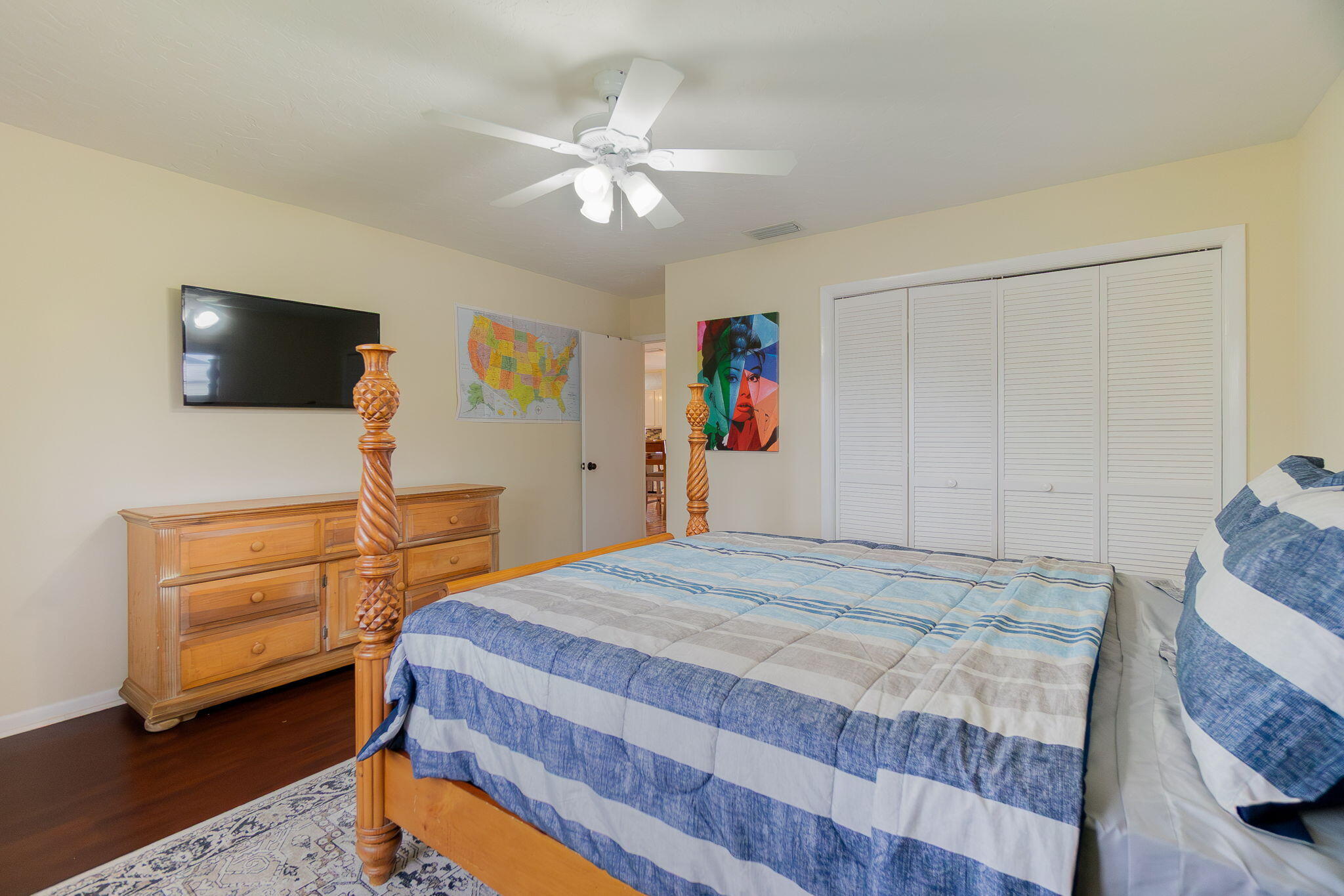 6130 Francis Street Jupiter, FL 33458 - Photo 13 of 27 a bedroom with a bed and a flat screen tv