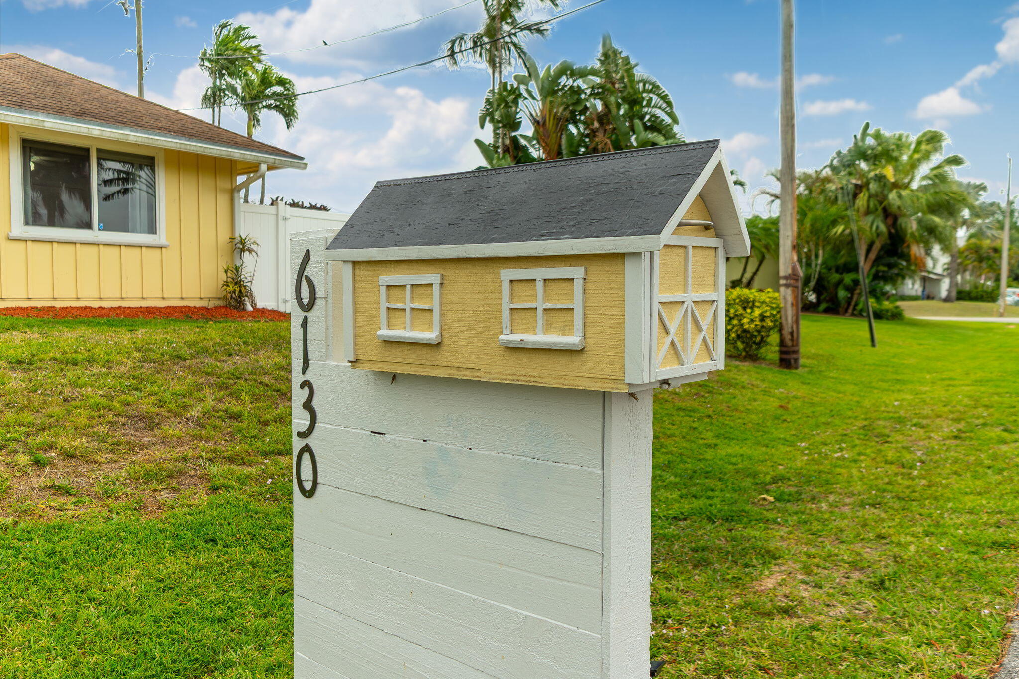 6130 Francis Street Jupiter, FL 33458 - Photo 21 of 27 a view of a house with a yard