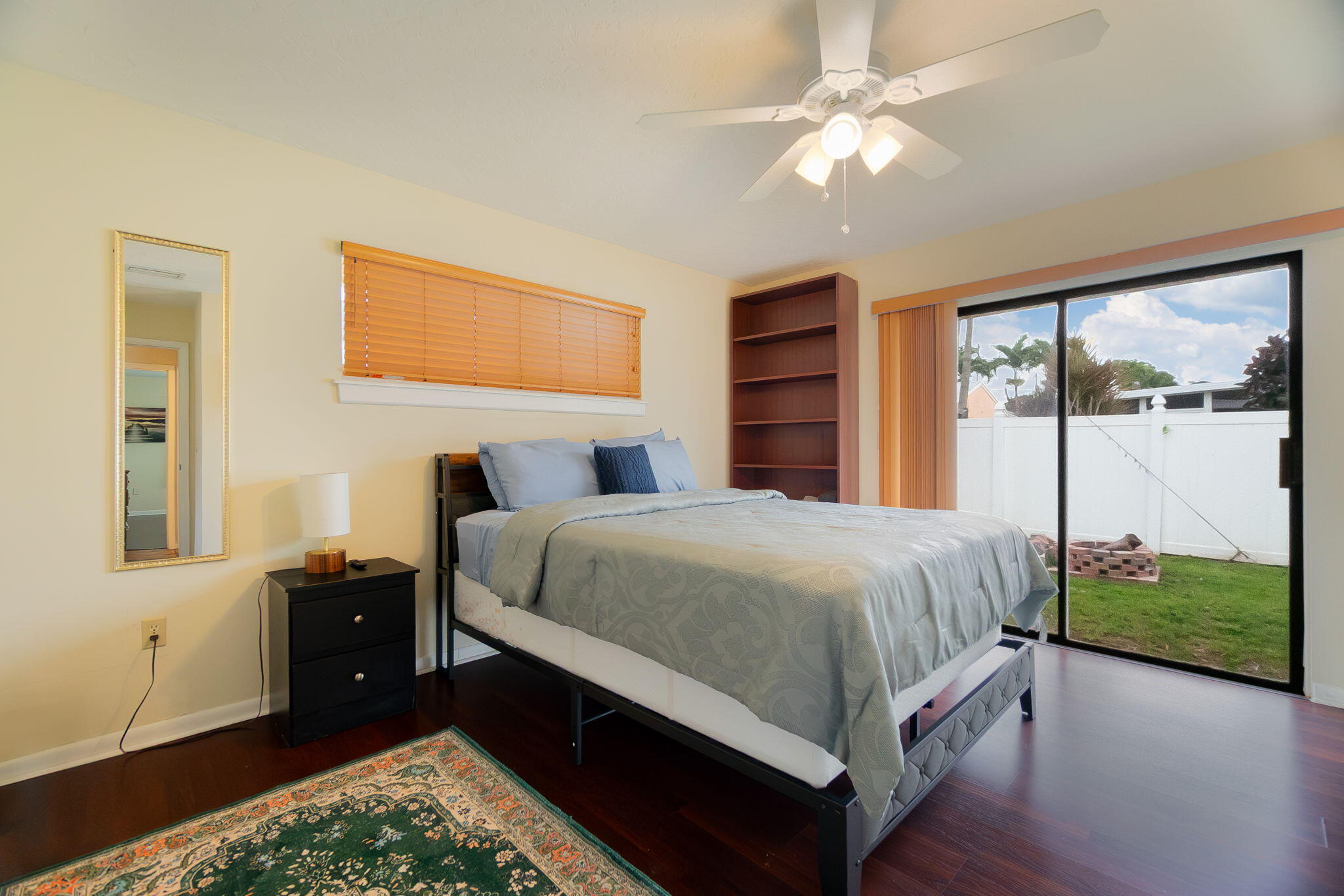 6130 Francis Street Jupiter, FL 33458 - Photo 10 of 27 a bed sitting in a bedroom next to a window