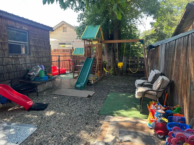 a view of a park with a slide