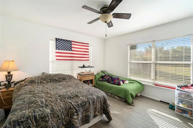 a bedroom with a bed and a dresser in it