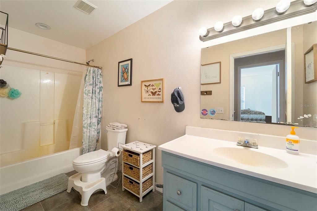 2215 Wallace Road Lutz, FL 33549 - Photo 13 of 15 a bathroom with a sink and a mirror