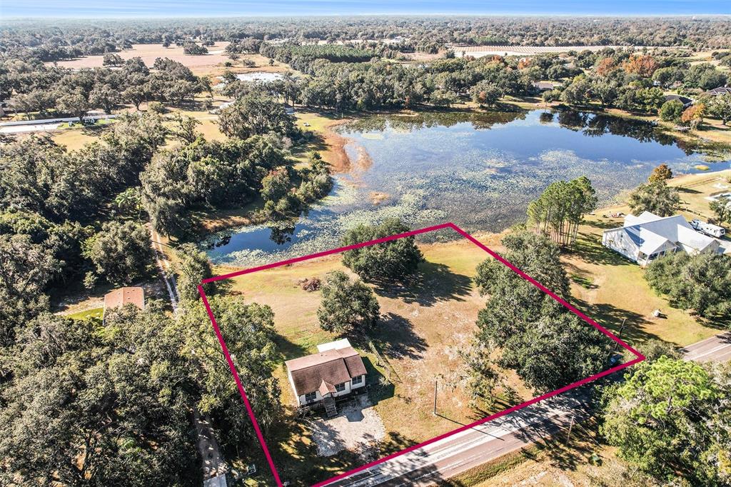 2215 Wallace Road Lutz, FL 33549 - Photo 2 of 15 an aerial view of residential houses with outdoor space