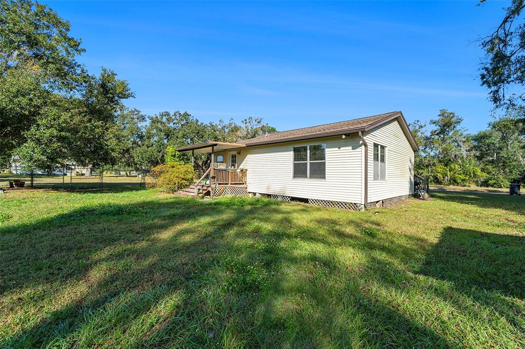 2215 Wallace Road Lutz, FL 33549 - Photo 3 of 15 a view of an house with backyard space and garden