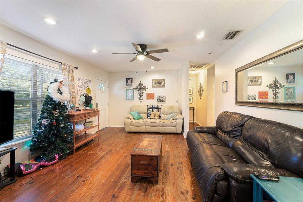 2215 Wallace Road Lutz, FL 33549 - Photo 5 of 15 a living room with furniture and a flat screen tv