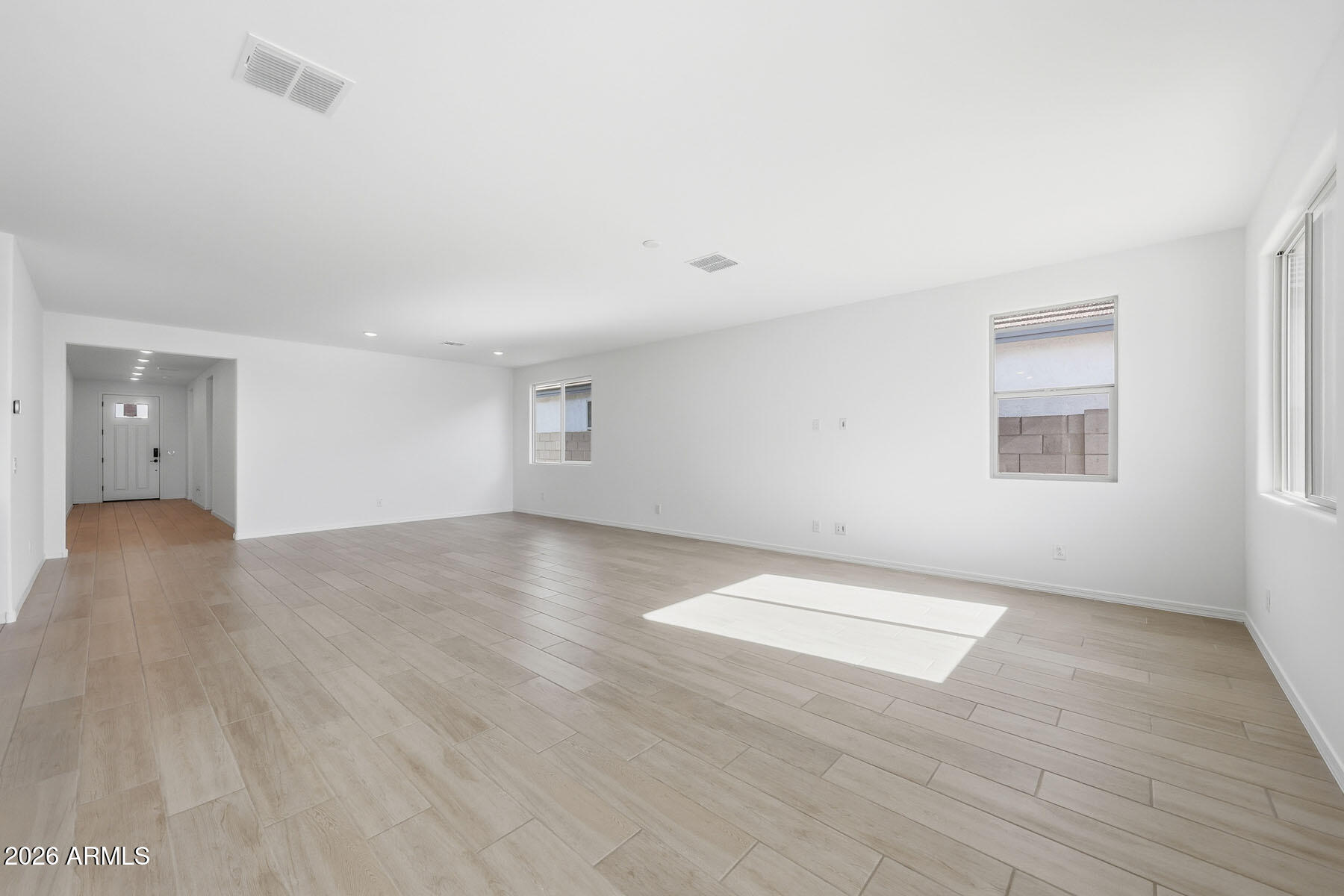 705 West Riparian Drive San Tan Valley, AZ 85140 - Photo 6 of 25 an empty room with wooden floor and windows