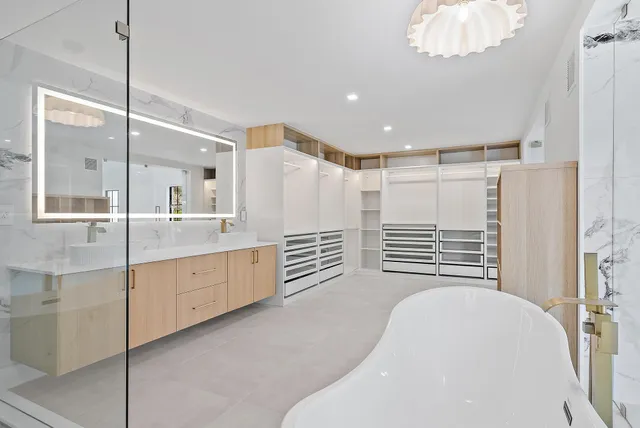 a big room with closet and windows