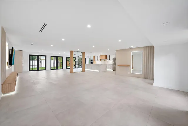 a view of kitchen with furniture and refrigerator